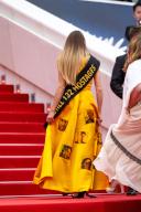 A woman wearing a yellow dress calling for the release of Israeli hostages held by Hamas movement, seen on the stairs, prior the screening of Mad Max âFuriosaâ, as part of 77th edition of Cannes Film Festival, in Cannes, France, on May 15, 2024. Photo by Ammar Abd Rabbo/ABACAPRESS