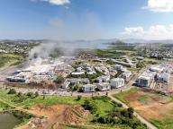 Aerial view of the Kenu-In shopping center in Dumbea, New Caledonia, May 18, 2024. One more person was killed Saturday and two injured in France