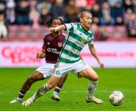 Daizen Maeda of Celtic, Japanese player in action against Dexter Lembikisa of Hearts during the cinch Scottish Premiership match between Heart of Midlothian and Celtic at Tynecastle Park, Edinburgh, Scotland on 3 March 2024