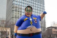 Protest demanding the impeachment of President Yoon Suk-Yeol, Feb 17, 2024 : A South Korean protester wearing a cut-out of the portrait of President Yoon Suk-Yeol performs to satirize Yoon who protesters insist, likes drinking and plays a king, during a rally demanding the impeachment of Yoon in Seoul, South Korea. Thousands of people attended the rally. Participants demanded Kim Keon-Hee, wife of President Yoon, to accept investigation by a special prosecution as they insist the first lady has been manipulating state affairs. The Korean letters read, "Yoon Suk-Yeol, the king to exercise his veto power against the legislations (that the main opposition Democratic Party railroaded through the National Assembly)". The Chinese letter reads,"King". (Photo by Lee Jae-Won/AFLO
