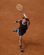 Yoshihito Nishioka of Japan returns a shot against Felix Auger-Aliassime of Canada during day four of the Mutua Madrid Open 2024 at Caja Magica on April 25, 2024, in Madrid, Spain