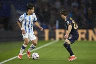 Takefusa Kubo of Real Sociedad competes for the ball with Fran Garcia of Real Madrid CF during the LaLiga EA Sports match between Real Sociedad and Real Madrid CF at Reale Arena on April 26, 2024, in San Sebastian, Spain