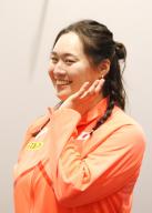 May 13, 2024, Tokyo, Japan - javelin throw world champion Haruka Kitaguchi smiles as she displays the logo mark of World Athletics Championships Tokyo 2025 at Japan