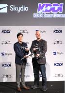May 13, 2024, Tokyo, Japan - KDDI executive officer Hiromichi Matsuda (L) and Skydio Japan president Tom Moss pose for photo as Japan