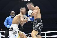 Jason Moloney (white gloves) of Australia and Yoshiki Takei (blue gloves) of Japan compete during their WBO world bantamweight title boxing bout at Tokyo Dome in Tokyo, Japan on May 6, 2024. (Photo by Hiroaki Finito Yamaguchi/AFLO