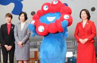 June 2, 2024, Tokyo, Japan - Japan Airlines (JAL) president Mitsuko Tottori (2nd L) and World Expo Minister Hanako Jimi (R) pose for photo with Myaku-Myaku (2nd R), mascot of the 2025 World Expo Osaka\/Kansai before JAL\'s Myaku-Myaku jet designed with Myaku-Myaku at the JAL hangar of the Haneda airport in Tokyo on Sunday, June 2, 2024. The new Myaku-Myaku jet will serve for the international route from June 3, while the first one was launched for the domestic route last year. (photo by Yoshio Tsunoda\/AFLO