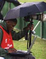 A photographer busy at work sending his pictures through to meet the deadlines.Hundreds of photogrpahers are expected to cover the 2010 World Cup.Thousands of local fans from South Africa attend the ABSA Soccer Cup final between the two largest ...
