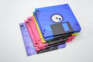 Retro media discs and floppy disks on a the white background