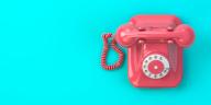 Pink vintage rotary telephone on mint green background. 3d illustration