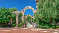 Ravadinovo, Bulgaria ÃÂ¢. Ã¢â¬Å 07. 11. 2019. Arched gate in the park of Ravadinovo castle, Bulgaria, on a summer sunny day