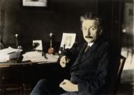 Einstein, Albert Physicist Ulm 14.3.1879 – Princeton (N.J.) 18.4.1955. Einstein in his study in Berlin.– Photo, 1921 (R.Sennecke); coloured later.