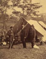[President Abraham Lincoln, Major General John A. McClernand (right), and E. J. Allen (Allan Pinkerton, left), Chief of the Secret Service of the United States, at Secret Service Department, Headquarters Army of the Potomac, near Antietam, Maryland]. Artist: Alexander Gardner (American, Glasgow, Scotland 1821-1882 Washington, D.C.). Dimensions: Image: 22.4 x 18 cm (8 13/16 x 7 1/16 in.)Mount: 29.2 x 20.7 cm (11 1/2 x 8 1/8 in.). Person in Photograph: Abraham Lincoln (American, Hardin County, Kentucky 1809-1865 Washington, D.C.); John Alexander McClernand (American, Breckinridge County, Kentucky 1812-1900 Springfield, Illinois); Allan Pinkerton (American, born Scotland, Glasgow 1819-1884 Chicago). Date: October 4, 1862.Two weeks after he recorded the carnage at Antietam, Alexander Gardner returned to the battlefield to photograph the visit of President Abraham Lincoln. The president made the seventy-mile journey to Maryland to pay his respects to the wounded on both sides and to confer with his field 