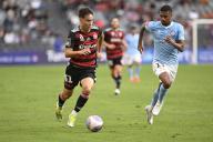 20th April 2024; CommBank Stadium, Sydney, NSW, Australia: A-League Football, Western Sydney Wanderers versus Melbourne City; Aidan Simmons of Western Sydney Wanderers runs with the ball persued by Leo Natel of Melbourne