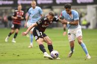 20th April 2024; CommBank Stadium, Sydney, NSW, Australia: A-League Football, Western Sydney Wanderers versus Melbourne City; Dylan Pierias of Western Sydney Wanderers takes a shot on goal despite being held by Vicente Fernandez of Melbourne