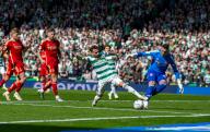 20th April 2024; Hampden Park, Glasgow, Scotland: Scottish Cup Football Semi Final, Aberdeen versus Celtic; Nicolas Kuhn of Celtic and Kelle Roos of Aberdeen challenge for the