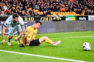 24th April 2024; Molineux Stadium, Wolverhampton, West Midlands, England; Premier League Football, Wolverhampton Wanderers versus Bournemouth; Hwang Hee-chan of Wolves tussles with Marcos Senesi of AFC