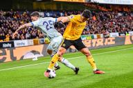 24th April 2024; Molineux Stadium, Wolverhampton, West Midlands, England; Premier League Football, Wolverhampton Wanderers versus Bournemouth; Hwang Hee-chan of Wolves tussles with Marcos Senesi of AFC
