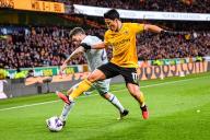 24th April 2024; Molineux Stadium, Wolverhampton, West Midlands, England; Premier League Football, Wolverhampton Wanderers versus Bournemouth; Hwang Hee-chan of Wolves challenges Marcos Senesi of AFC