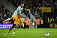 24th April 2024; Molineux Stadium, Wolverhampton, West Midlands, England; Premier League Football, Wolverhampton Wanderers versus Bournemouth; Antoine Semenyo of AFC Bournemouth looks to leap over Boubacar Traore of