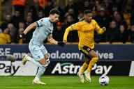 24th April 2024; Molineux Stadium, Wolverhampton, West Midlands, England; Premier League Football, Wolverhampton Wanderers versus Bournemouth; Dominic Solanke of AFC Bournemouth looks to beat Nelson Semedo of