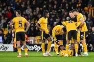 24th April 2024; Molineux Stadium, Wolverhampton, West Midlands, England; Premier League Football, Wolverhampton Wanderers versus Bournemouth; Nelson Semedo of Wolves gets help with