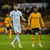 24th April 2024; Molineux Stadium, Wolverhampton, West Midlands, England; Premier League Football, Wolverhampton Wanderers versus Bournemouth; Dominic Solanke of AFC Bournemouth is tracked by Nelson Semedo of