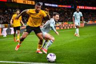 24th April 2024; Molineux Stadium, Wolverhampton, West Midlands, England; Premier League Football, Wolverhampton Wanderers versus Bournemouth; Mario Lemina of Wolves tussles with Adam Smith of AFC