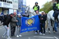 26th April 2024; Loftus Road Stadium, Shepherds Bush, West London, England; EFL Championship Football, Queens Park Rangers versus Leeds United; Fans posing for a photograph with a mounted police officer outside the stadium