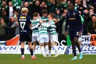 28th April 2024; Dens Park, Dundee, Scotland; Scottish Premiership Football, Dundee versus Celtic; James Forrest of Celtic is congratulated after scoring for 1