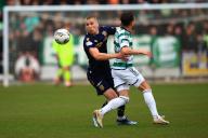 28th April 2024; Dens Park, Dundee, Scotland; Scottish Premiership Football, Dundee versus Celtic; Owen Dodgson of Dundee challenges for the ball with Nicolas Kuhn of Celtic