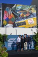 2nd May 2024; Miami International Autodrome, Miami, Florida, USA; Formula 1 Crypto.com Miami Grand Prix 2024; Arrival and Inspection Day; From left Brazilian street artist Kobra, an English interpreter, Miami Dolphins CEO Tom Garfinkel and Guenther Steiner pose after the unveiling of a mural of Ayrton Senna paying tribute to the 30th anniversary of his passing