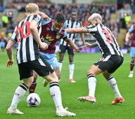 4th May 2024; Turf Moor, Burnley, Lancashire, England; Premier League Football, Burnley versus Newcastle United; Lewis Hall and Bruno Guimaraes of Newcastle tussle with Lorenz Assignon of