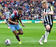 4th May 2024; Turf Moor, Burnley, Lancashire, England; Premier League Football, Burnley versus Newcastle United; Lewis Hall of Newcastle beten by Lorenz Assignon of