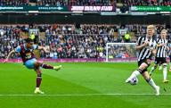 4th May 2024; Turf Moor, Burnley, Lancashire, England; Premier League Football, Burnley versus Newcastle United; Lorenz Assignon of Burnley shoots at goal while Lewis Hall of Newcastle reaches to block the shot
