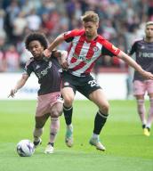 4th May 2024; Gtech Community Stadium, Brentford, London, England; Premier League Football, Brentford versus Fulham; Willian of Fulham and Kristoffer Ajer of Brentford grapple for