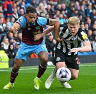4th May 2024; Turf Moor, Burnley, Lancashire, England; Premier League Football, Burnley versus Newcastle United; Lorenz Assignon of Burnley tussles with Lewis Hall of Newcastle for the
