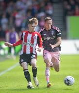 4th May 2024; Gtech Community Stadium, Brentford, London, England; Premier League Football, Brentford versus Fulham; Keane Lewis-Potter of Brentford passes the ball under pressure by Timothy Castagne of Fulham