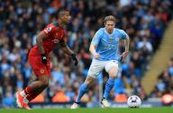 4th May 2024; Etihad Stadium, Manchester, England; Premier League Football, Manchester City versus Wolverhampton Wanderers; Mario Lemina of Wolverhampton Wanderers controls the ball under pressure from Kevin de Bruyne of Manchester