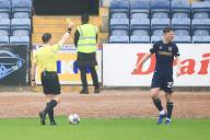 4th May 2024; Dens Park, Dundee, Scotland; Scottish Premiership Football, Dundee versus St Mirren; Aaron Donnelly of Dundee is yellow carded by referee Matthew MacDermid