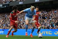 4th May 2024; Etihad Stadium, Manchester, England; Premier League Football, Manchester City versus Wolverhampton Wanderers; Erling Haaland of Manchester City holds off a challenge from Ryan Ait-Nouri and Joao Gomes of Wolverhampton