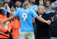 4th May 2024; Etihad Stadium, Manchester, England; Premier League Football, Manchester City versus Wolverhampton Wanderers; Manchester City manager Pep Guardiola congratulates Erling Haaland as he is substituted but Haaland shows his frustration at being taken