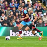 4th May 2024; Turf Moor, Burnley, Lancashire, England; Premier League Football, Burnley versus Newcastle United; Bruno Guimaraes of Newcastle passes the ball while under pressure from Sander Berge of