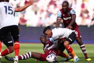 11th May 2024; London Stadium, London, England; Premier League Football, West Ham United versus Luton Town; Gabriel Osho of Luton Town competes for the ball with Kurt Zouma of West Ham