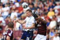 11th May 2024; Tynecastle Park, Edinburgh, Scotland: Scottish Premiership Football, Heart of Midlothian versus Dundee; Michael Mellon of Dundee competes in the air with Dexter Lembikisa of Heart of Midlothian
