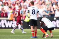 11th May 2024; London Stadium, London, England; Premier League Football, West Ham United versus Luton Town; A dejected Elijah Adebayo of Luton Town is consoled by Luke Berry after the 3-1