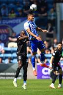 18th May 2024; Dens Park, Dundee, Scotland: Scottish Premiership Football, Dundee versus Kilmarnock; Corrie Ndaba of Kilmarnock heads clear from Mohamad Sylla of Dundee
