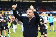 18th May 2024; Dens Park, Dundee, Scotland: Scottish Premiership Football, Dundee versus Kilmarnock; Dundee manager Tony Docherty gives a thumbs up to the fans at full