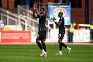 18th May 2024; Dens Park, Dundee, Scotland: Scottish Premiership Football, Dundee versus Kilmarnock; Amadou Bakayoko and Mohamad Sylla of Dundee applaud the fans as they are