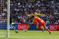 18th May 2024; Wembley Stadium, London, England; EFL League One Play Off Football Final, Bolton Wanderers versus Oxford United; Josh Murphy of Oxford United goes around goalkeeper Nathan Baxter of Bolton Wanderers to score in the 42nd minute for 0-2