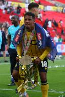 18th May 2024; Wembley Stadium, London, England; EFL League One Play Off Football Final, Bolton Wanderers versus Oxford United; Marcus McGuane of Oxford United celebrates with the Sky Bet League One Play-off winner trophy